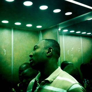Peter DiCampo’s photo of a man in an elevator in Abidjan, Ivory Coast, led him to reflect on the many stereotypical images of Africa that are published, Tara Pixley wrote for Nieman Reports. (Peter DiCampo/Everyday Africa)